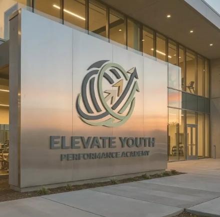 Elevate Youth Performance Academy — building exterior signage at sunset, concept mockup