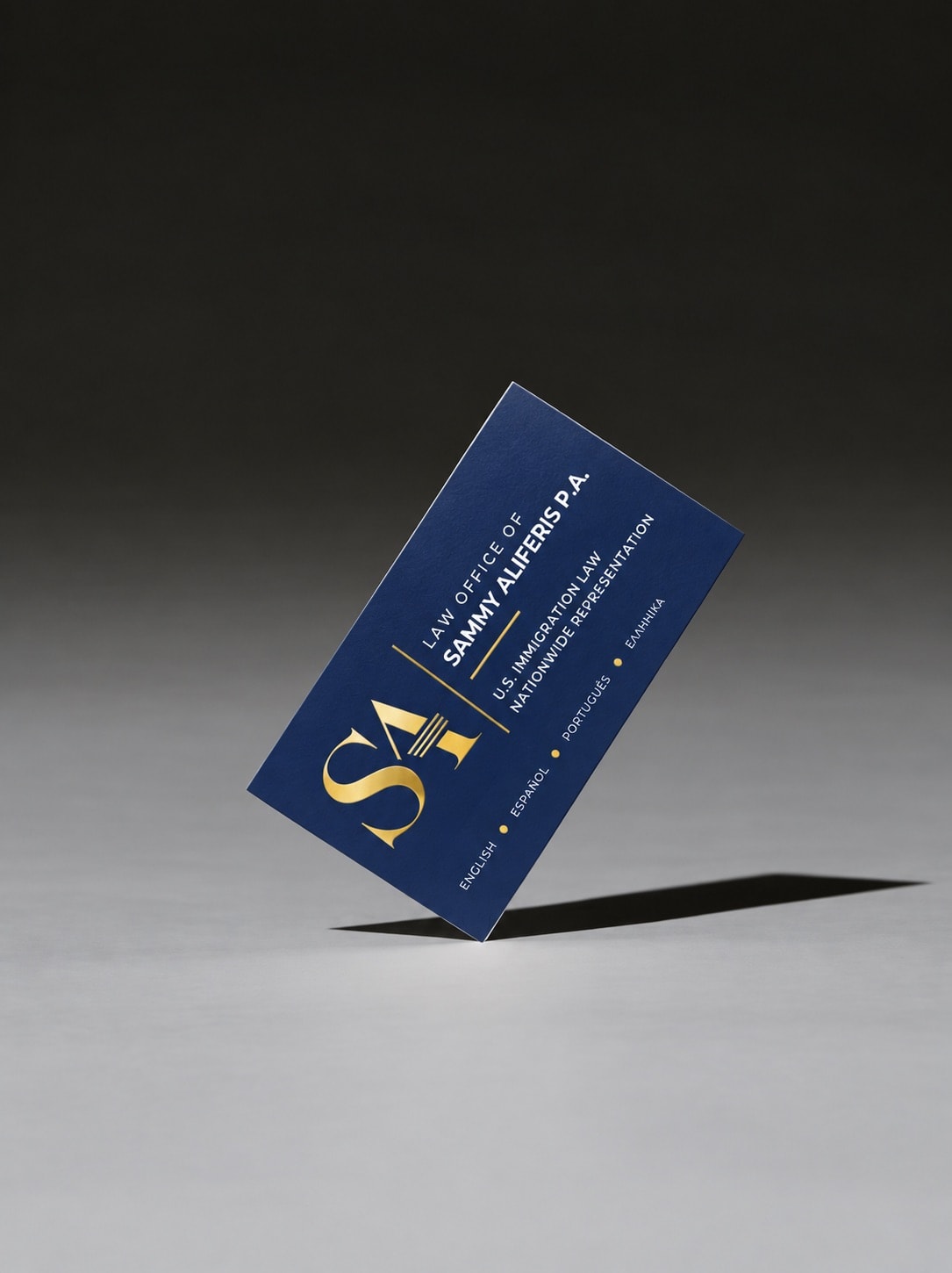 Law Office of Sammy Aliferis P.A. business card — navy and gold