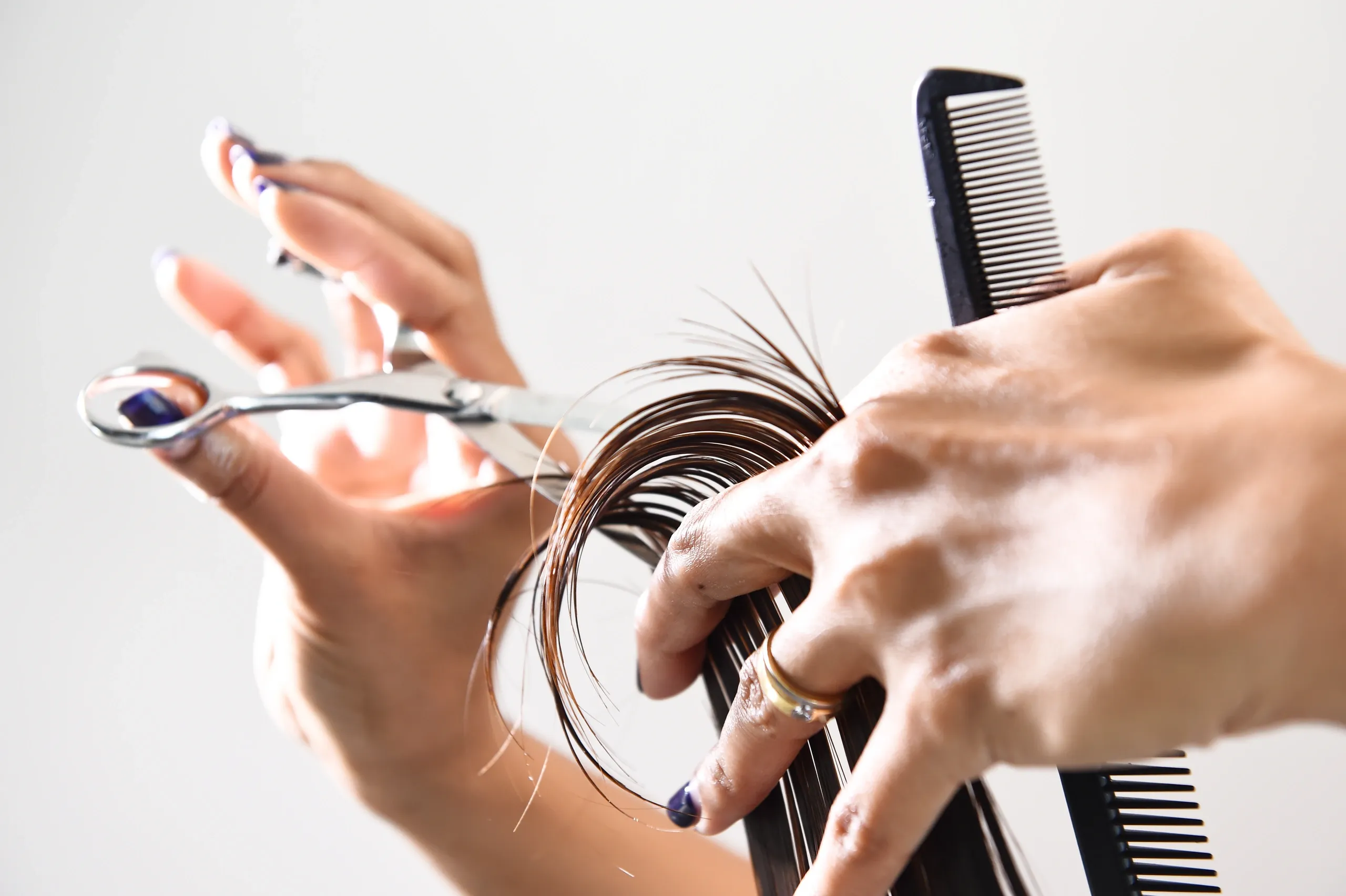 Naurys — hands with styling tools, scissors and comb